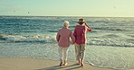 Senior women, friends and back at beach with holding hands, care and bonding with reunion by sea. Elderly lady, people and tropical with waves, ocean and freedom on vacation, walking and retirement