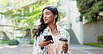 Businesswoman, cellphone and coffee on online travel communication, working connection urban professional. Indian woman, mobile device and caffeine drink on bridge for texting, corporate or walking