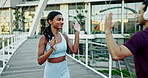 High five, runner or woman in city for fitness training, exercise or cardio workout on outdoor bridge. Greeting, friends or happy Indian sports athlete with motivation for running on urban street 