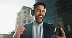 Happy, dance and businessman with headphones in city for job promotion celebration with phone. Smile, cellphone and excited professional young male person listening to music, radio or album in town.