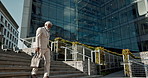 City, business and stairs with old man, walking and corporate with a briefcase, sunshine and buildings. Elderly person, employee and entrepreneur with urban town, steps and New York with professional