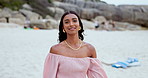 Face, beach and walking with woman, smile and vacation with happiness, weekend break and nature. Portrait, person and girl with adventure, excited and travel with journey, peace and calm with holiday
