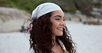 Woman, peace and relaxing on beach vacation, smiling and happy in outdoors or travel to ocean for fun. Female person, freedom and satisfaction or wellness in nature, peace and holiday or getaway
