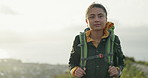 Woman, hiking and mountains with backpack, nature or location for trekking, vision or thinking. Girl, workout and exercise on hill, path or trail with bag, outdoor or ideas for challenge on adventure