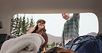 Couple, car trunk and luggage for road trip, travel or holiday with baggage, ready and talking. Man, woman and transport for journey with bag, backpack and happy in nature, woods or vehicle in Spain