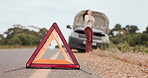 Woman, car breakdown and reflector triangle with phone call, stress or emergency on road in countryside. Girl, driver and vehicle fail on smartphone for problem solving, solution or insurance policy