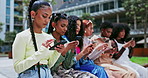 Women, friends and typing on smartphone in outdoors, internet and scrolling on social media. People, technology and connection for website and mobile application, online and sitting together outside
