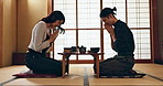 Couple, bow for hello and eating food, Asian people on date with respect, culture and love together in Japan. Hungry for Japanese cuisine, trust with commitment and greeting for religion and care