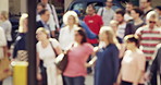 Group of people on their morning commute through a city street