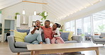 Support, black family on sofa and in living room of their home happy together smiling. Support or care, happiness or bonding time and African people cuddle on couch in their house for positivity