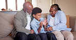 Grandparents, child and tickle or playing on couch, bonding and affection or laughing for game. Black family, happiness and care for boy in living room, having fun and silly or goofy humor at home