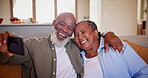 Senior couple, embrace and smile in selfie, support and commitment to marriage or happy at home. Black elderly people, hug and laughing for humor on sofa, phone and photograph for profile picture