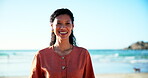 Woman, face and happy for holiday on beach, nature and  relax in summer for travel adventure. Brazilian person, smile and portrait on vacation in cape town, sunshine and trip to ocean for wellness