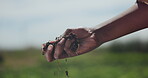 Hands, farmer and soil for agriculture, dirt and check quality of mud on earth ecology. Closeup, fingers and person with sand in nature, fertilizer and organic compost at field environment for growth