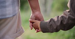 Holding hands, parent or child hiking in forest to relax on holiday vacation together in nature. Child closeup, dad or back of father in woods trekking on outdoor adventure for love, support or care