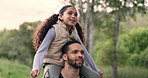 Nature, happy and child on shoulders of father for hiking adventure in outdoor forest together. Smile, care and young dad carrying girl kid for trekking or walking in the woods on weekend trip.