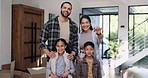 Smile, family and keys to new home for goals, target or investment and milestone celebration closeup. Portrait, love or happy with mom, dad and children proud of property or real estate purchase