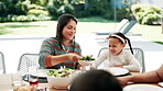 Mother, serve food and child at lunch celebration for healthy salad eating at social birthday for nutrition, hungry or brunch. Female person, bowl and young girl at table for family, meal or vacation