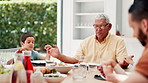 Praying, holding hands and grandparents with children for lunch, dinner and eating together in home. Family, love and grandpa, parents and kids say prayer for religion, worship and bonding with food