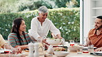 Food, outdoor and grandparents with big family or child at table in thanksgiving celebration or tradition. Salad, share or lunch with people, grandma or kid eating meal together in a social gathering