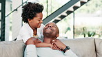 Happy father, child and hug on sofa for love, support or care in fun bonding, holiday or weekend together at home. African dad, kid or son smile for embrace, relax and sitting on living room couch