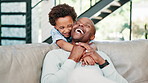 Happy dad, child and hug on sofa for love, support or care in fun bonding, holiday or weekend together at home. African father, kid or son smile for embrace, relax and sitting on living room couch