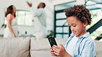 Frustrated couple, kid and phone in conflict, disagreement or argument in living room at home. Mother, father and little boy on mobile smartphone while parents fight in divorce, breakup or affair