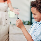 Discipline, mother and kid with phone playing game, addiction and happy ...