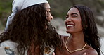 Lesbian women, laughter and happy couple hug, freedom and adventure outdoor with love and trust. Interracial lgbt relationship, pride and fun together on date at beach with support and care in nature