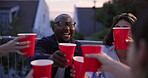 Friends, group and hands or cheers drink as celebration party for new years, social activity or outdoor. People, diversity and toast red cups on rooftop as community for summer, holiday or travel