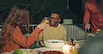 Friends, toast and outdoor dinner on patio, night and conversation with food, new years eve and party. Women, man and group at table with juice, memory or celebration with cheers, diversity and event