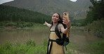 Happy woman, phone and backpack live recording forest, nature or peaceful outdoor scenery by the lake. Female person or hiker smile with mobile smartphone for vlog, social media or online video