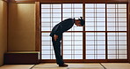 Bow, taekwondo or Asian man in dojo for martial arts for fitness, discipline or self defense for respect or honor. Kung fu master, workout or person in training for fighting, karate or combat sports