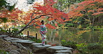 Walking, lake or calm Asian woman in park for journey on holiday vacation for freedom or wellness. Nature, travel or Japanese person with ideas for health, peace and inspiration to relax in forest