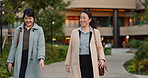 Walking, conversation and business women in the city talking for communication or bonding. Smile, discussion and professional Asian female people speaking and laughing together commuting in town.