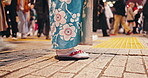 Japanese, woman and standing in city in kimono, urban town and wellness in street for buddhism heritage. Person, travel or traditional clothes in tokyo culture or girl waiting in peace in respect