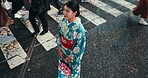 Japan, woman and standing in city in kimono, pedestrian crossing and thinking in street of heritage. Person, sightseeing or traditional clothes in tokyo culture or commuting in style dress as fashion
