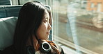 Train, commute and woman with headphones on journey, transportation or travel in Japan. City, metro and girl at window with audio technology thinking in town or relax with safe infrastructure