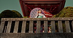 Japanese woman, umbrella and shinto temple with traditional clothes, culture and religion in sunshine. Person, girl and parasol for walk with faith, mindfulness and thinking with low angle in Kyoto
