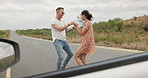 Nature, dancing and young couple on road trip in countryside listening to music together. Happy, love and man and woman moving to song, playlist or radio by car on vacation, adventure or holiday.