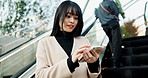 Japanese woman, smile and smartphone in escalator in city, connection and technology for business. Young person, happy and cellphone in tokyo for social media, communication and online in urban town