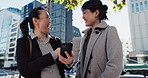 Japanese businesswomen, talking or smartphone in city with networking, collaboration or connection on sidewalk. People, happy and cellphone by online blog on website, agreement and technology in town