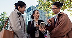 Business people, Japan and group with a cellphone, internet and conversation with digital app, connection and discussion. Hiroshima, manager and employees with smartphone, coworkers and urban town