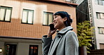 Japanese business woman, phone call and city on walk to workplace with communication, contact or networking. Person, corporate employee and smartphone for conversation, negotiation or deal in Tokyo