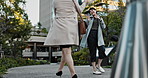 Japanese businesswomen, excited and walking to work, morning respect and fun emoji on sidewalk in city. People, professional workers and gesture greeting on street for career and job in urban town