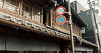 Sign, road and view of Japanese architecture, signage and infrastructure on the street. Tourism, urban and traditional house or building in a own or Asian city for holiday, vacation or culture