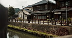 Japan, architecture and canal by houses in countryside with trees and nature in outdoor with water conservation. Tokyo, home design and garden landscaping, plants and sustainable environment by river