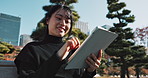 Happy asian woman, tablet and research at park in city for social media or outdoor networking. Female person smile with technology in relax for online search, reading or communication in nature