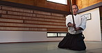 Fitness, stick or sensei martial arts in dojo for practice routine, aikido movement or self defense. Combat demonstration, mature Japanese person or training workout for fighting, education or class