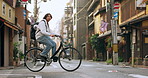 Bicycle, travel and man riding in the city for exercise or transportation to college academy. Fitness, backpack and young male student driving a bike to university for carbon footprint in urban town.